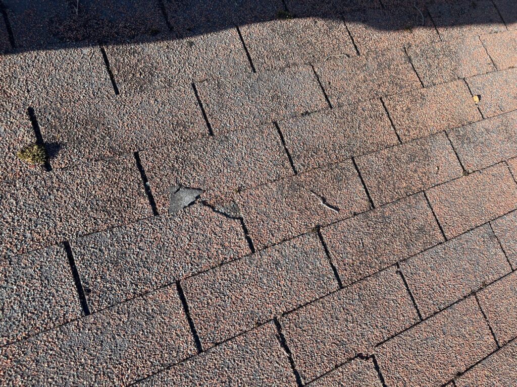 Damaged shingles needing repair Fulton NY to be repaired by Northland Roofing